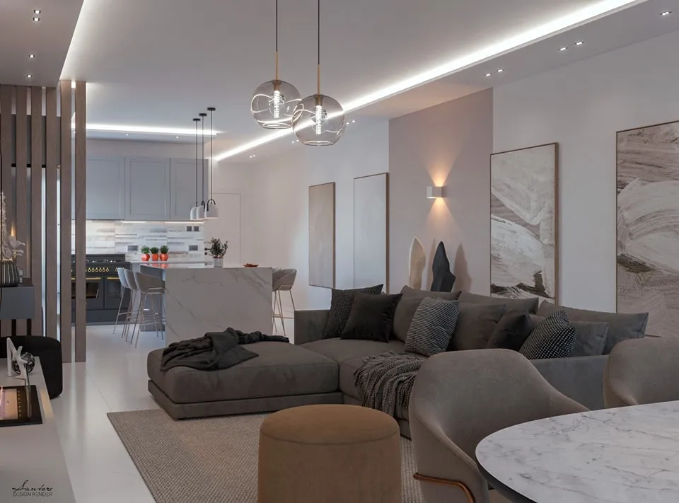 Integrazione tra luce naturale e illuminazione artificiale diffusa per garantire equilibrio luminoso e comfort visivo nell’intero ambiente living–cucina.